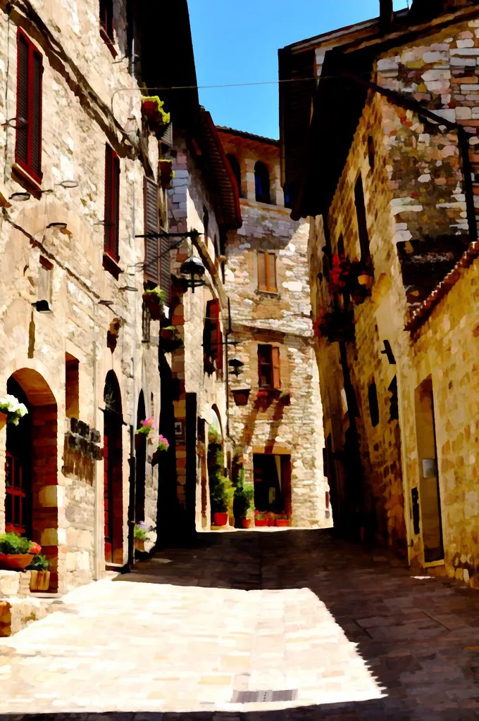 Narrow cobbled street inside Assisi's historic center, the kind of ZTL-restricted lane where cars are not allowed