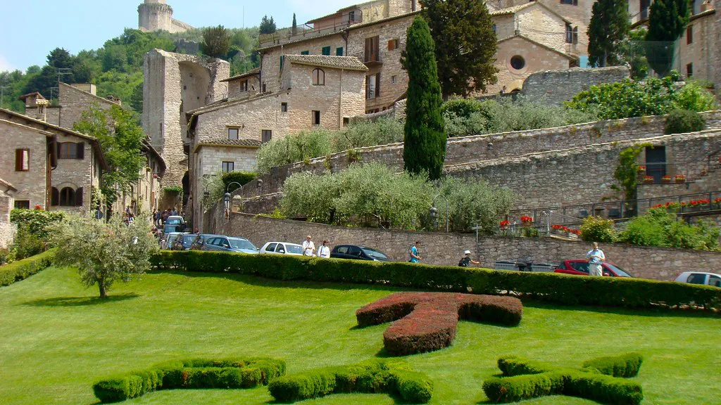 Panoramic view over Assisi and the green Umbrian valley below the hilltop town