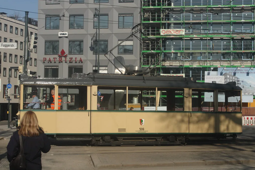 An Augsburg AVV tram on a city street