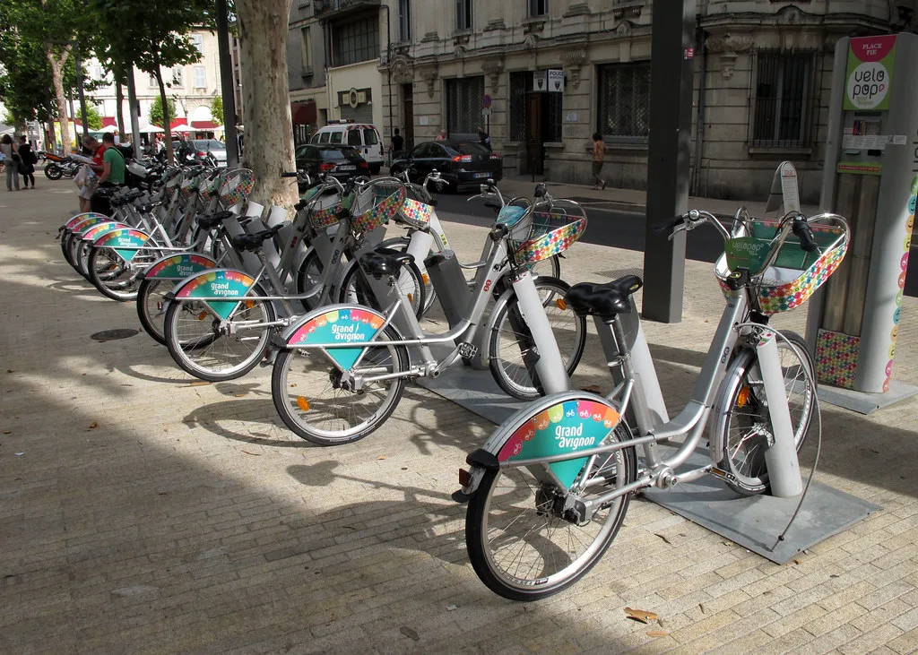 A row of rental bicycles available for hire, similar to Avignon's Vélopop bike-share