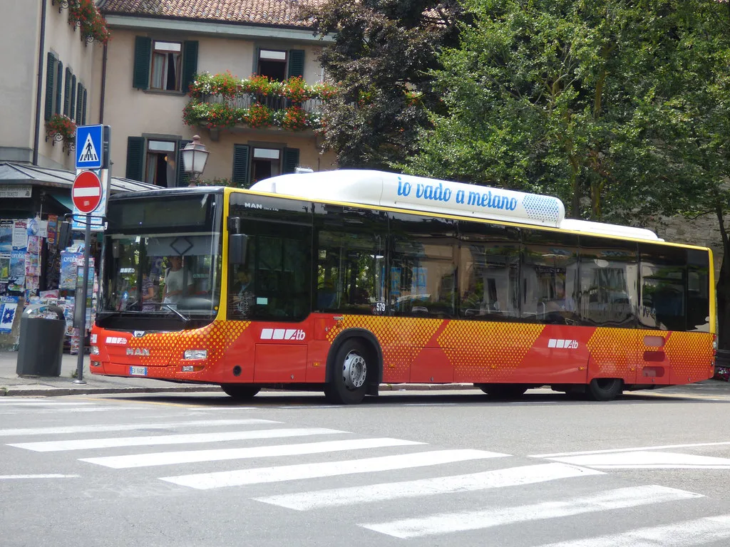 A blue ATB city bus parked at Largo Colle Aperto in Bergamo's Upper City