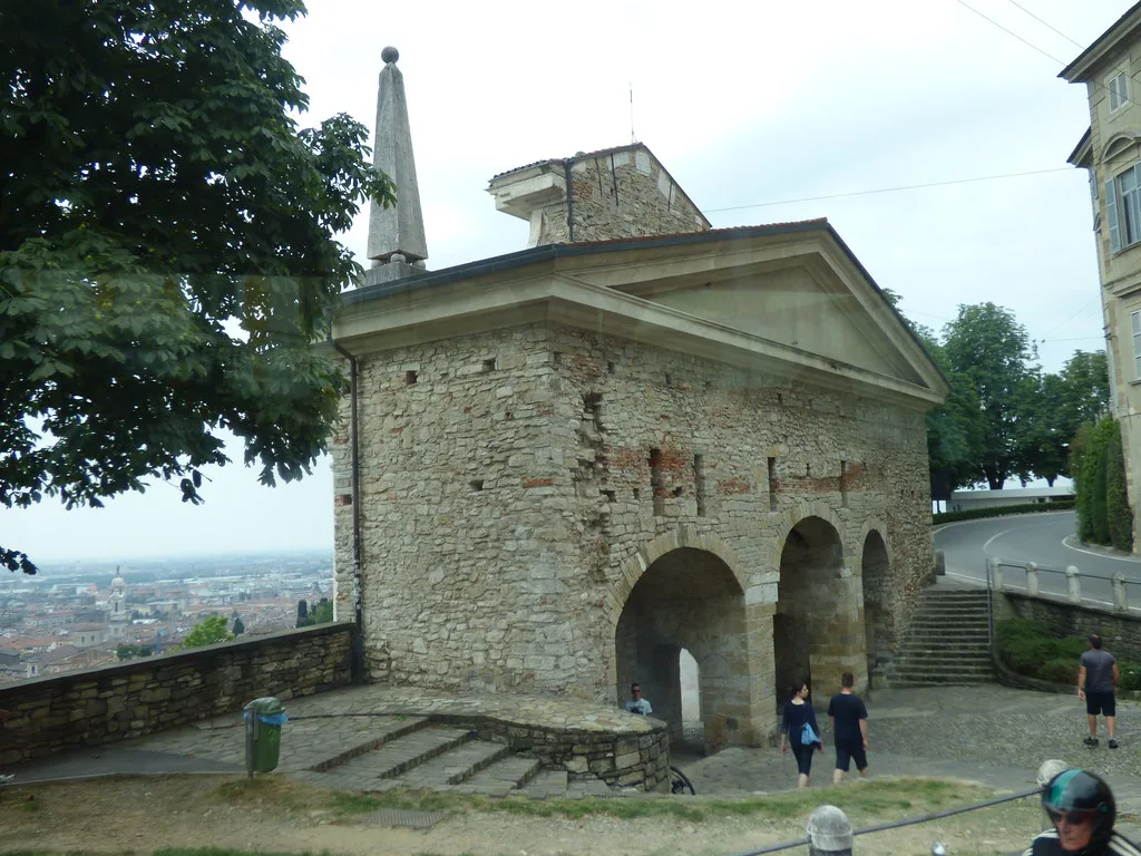 Porta San Giacomo, a stone gate in Bergamo's UNESCO-listed Venetian Walls leading into the pedestrian Città Alta