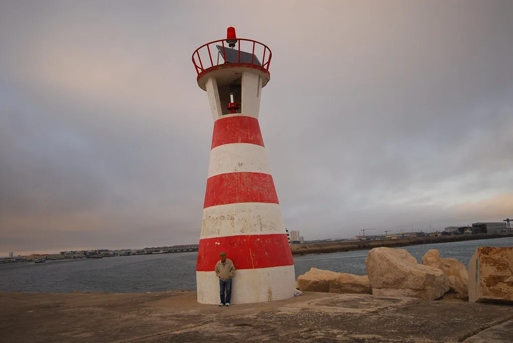 The lighthouse on the harbour wall at Peniche, the coastal town where the Berlenga ferries depart