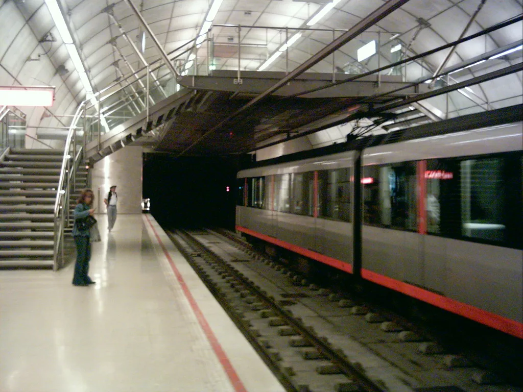 A Bilbao metro train waiting at a platform where Barik cards are tapped
