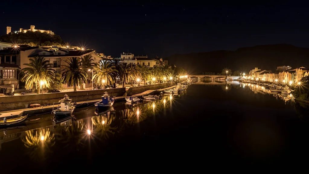 The Temo river and Ponte Vecchio leading into Bosa's historic centre in Sardinia