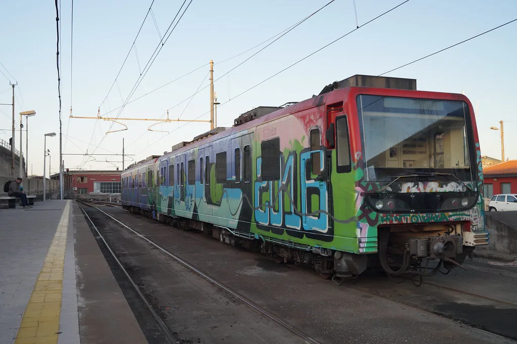 An FCE metro train on Catania's Line M1 at a city station