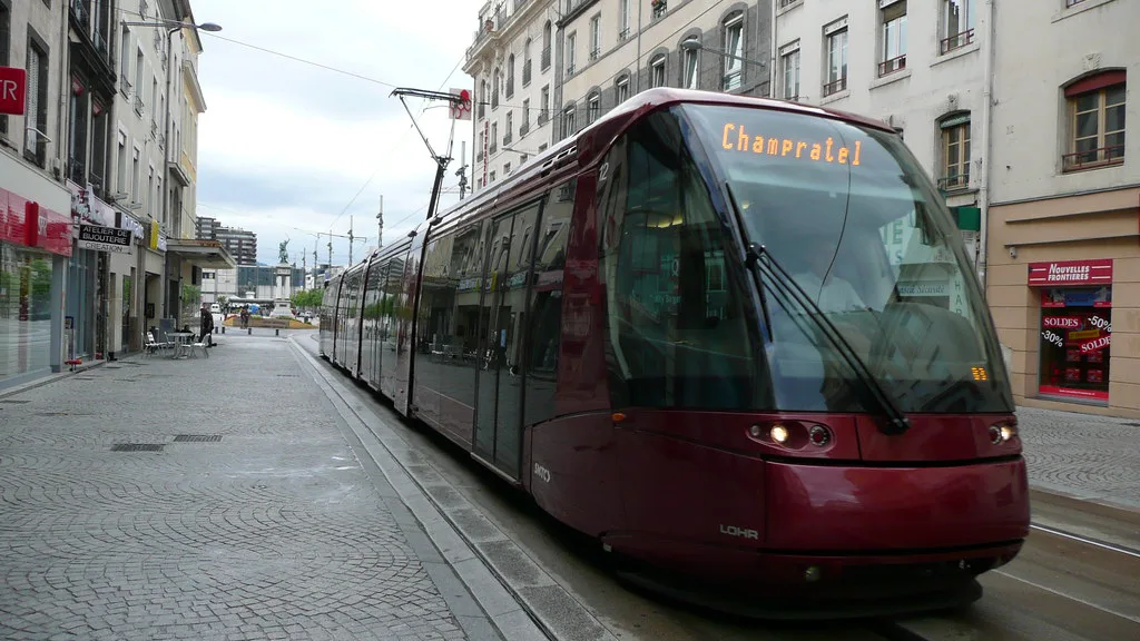 A rubber-tired T2C tram gliding along Tram Line A through central Clermont-Ferrand