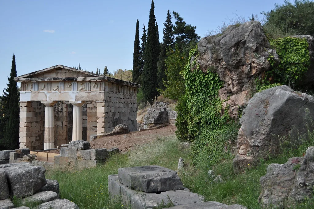 The ancient ruins of the Delphi Archaeological Site in Greece set against the Phocis mountainside