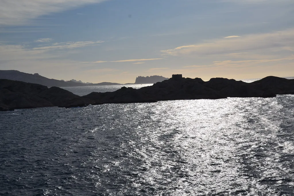 The arid white limestone landscape and turquoise coves of the Frioul Islands near Marseille