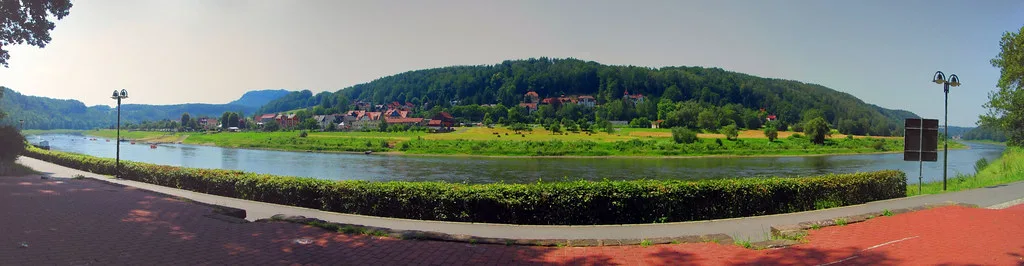 A scenic ferry crossing the Elbe river in Dresden