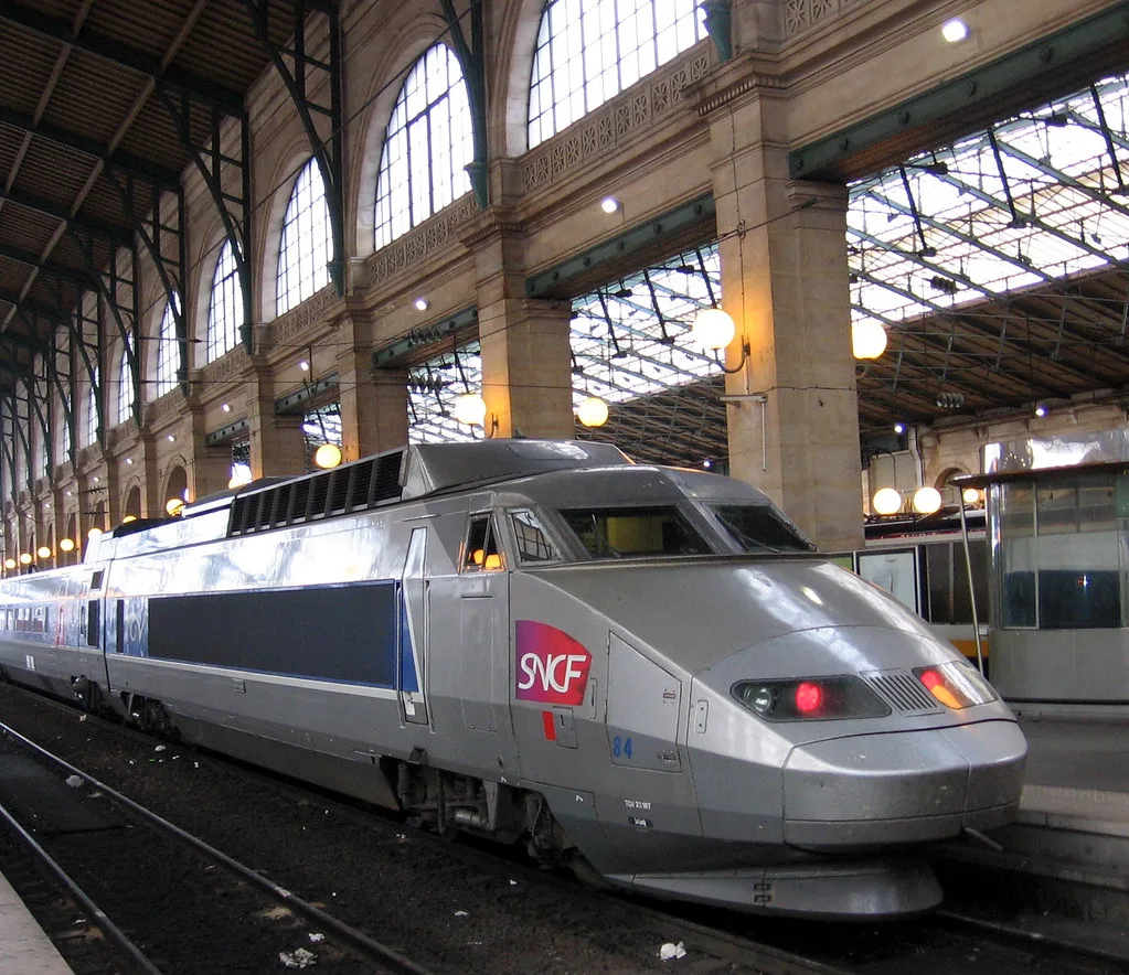 An SNCF TGV high-speed train waiting at the platform of Gare du Nord in Paris