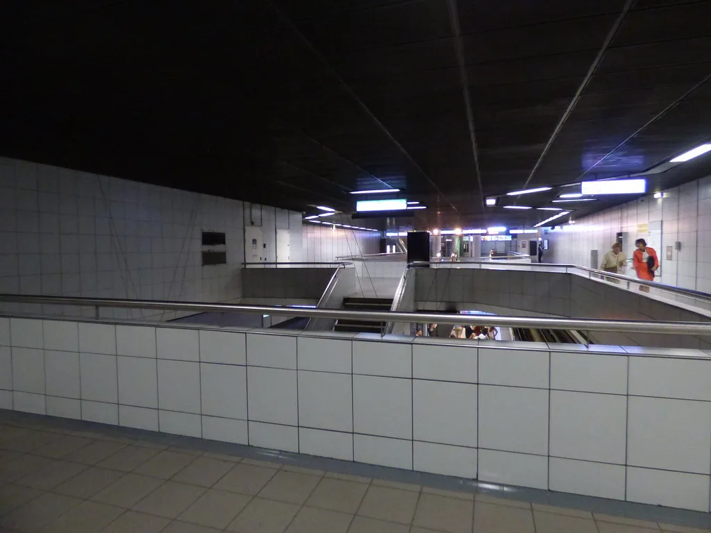 A European metro platform with a subway train at the Bellecour station on Lyon Metro line D