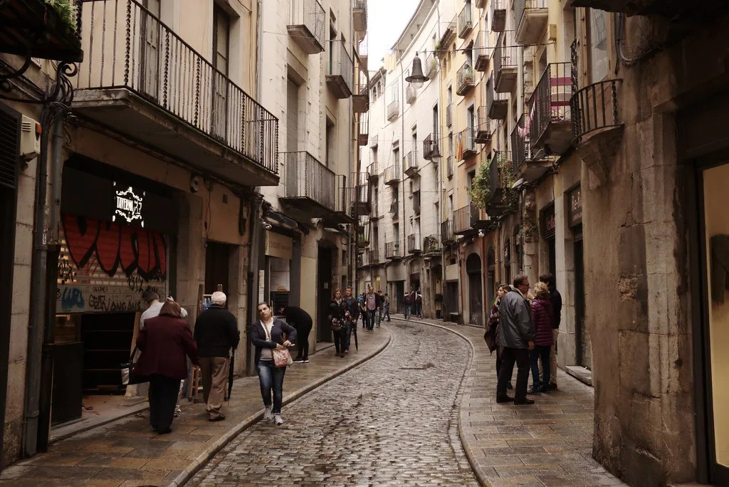 Street scene in central Girona where local TMG urban bus lines connect