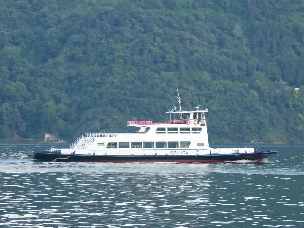 A Navigazione Laghi passenger ferry on the blue waters of Lake Como