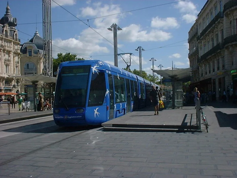 A colourful Montpellier TaM tram on its tracks in the city