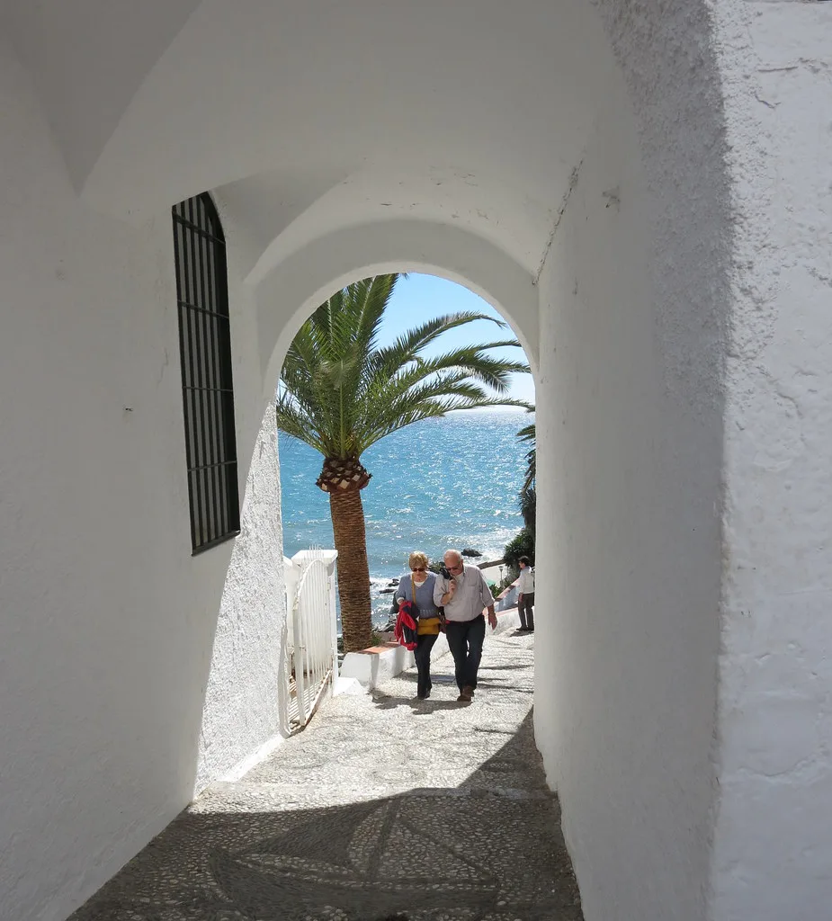 Whitewashed streets and seafront of Nerja old town near Plaza de España, an easy walk from the Balcón de Europa car park