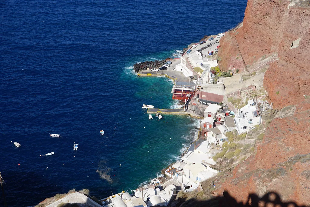 Ammoudi Bay below Oia in Santorini, with its tiny narrow waterfront lot reached down 200-plus steps from the village