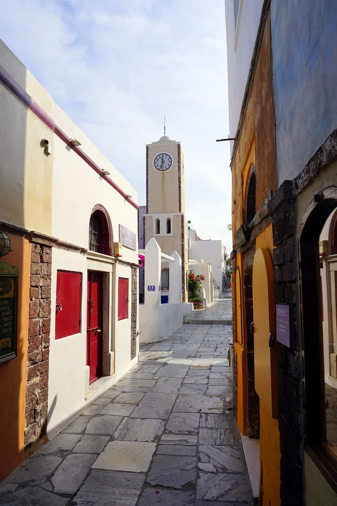 A narrow pedestrian marble street in the village of Oia, Santorini, where the KTEL bus drops visitors steps from the square