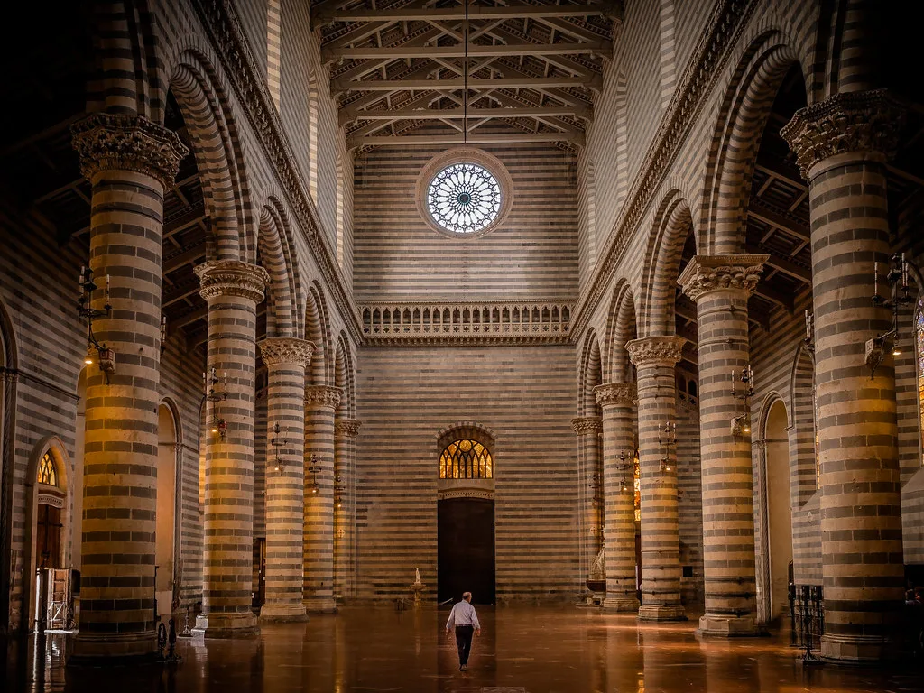 The golden mosaic facade of the Duomo di Orvieto cathedral in Umbria, Italy