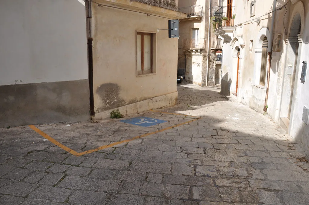 On-street parking signs and bays in Ragusa Ibla near the historic center