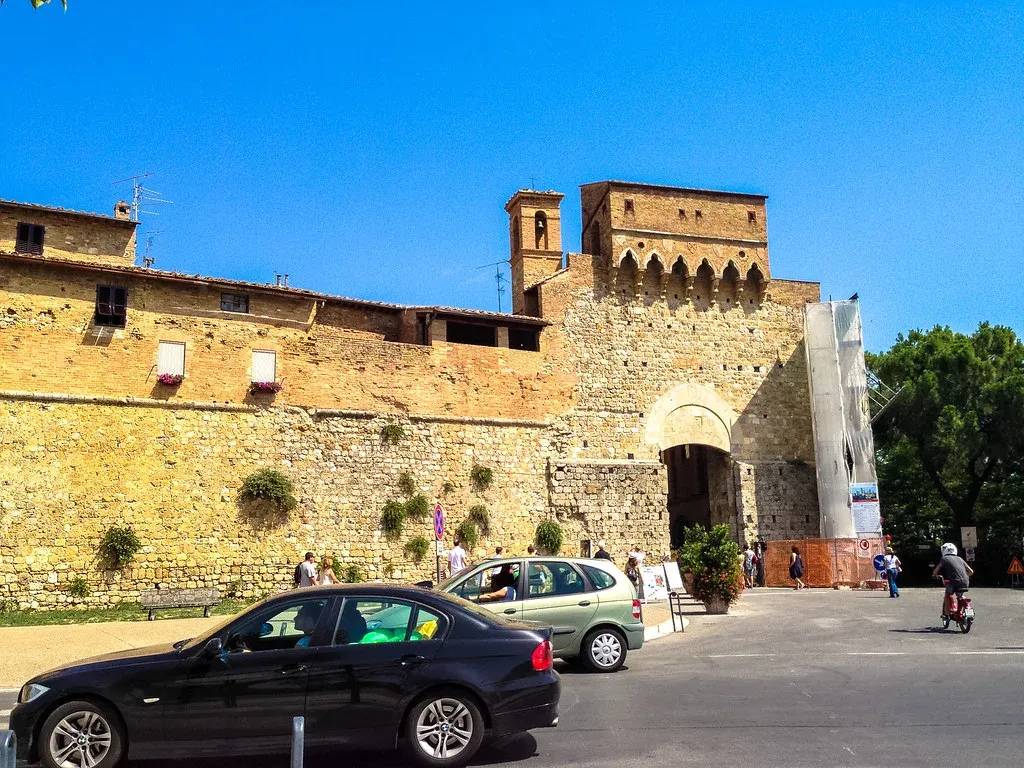 Porta San Giovanni, the historic stone gate into San Gimignano, just steps from the P2 Montemaggio lot