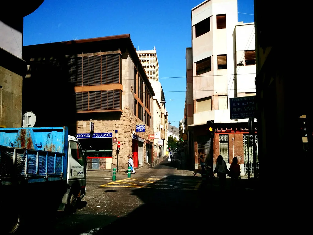 A narrow street in central Santa Cruz de Tenerife lined with buildings