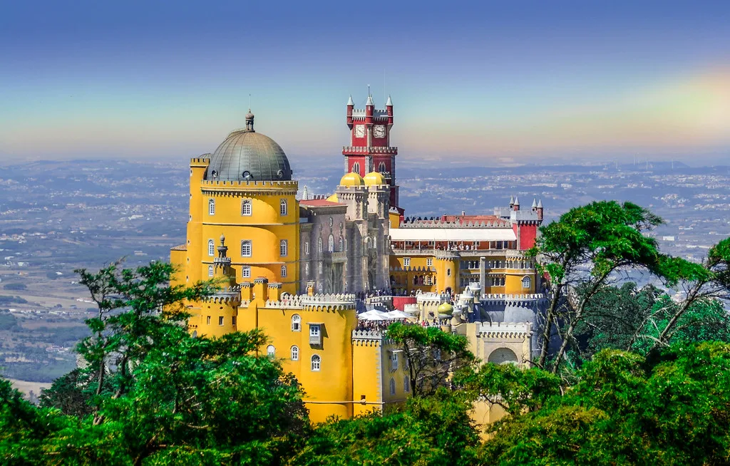 The colorful Pena Palace perched on a hilltop above Sintra, Portugal