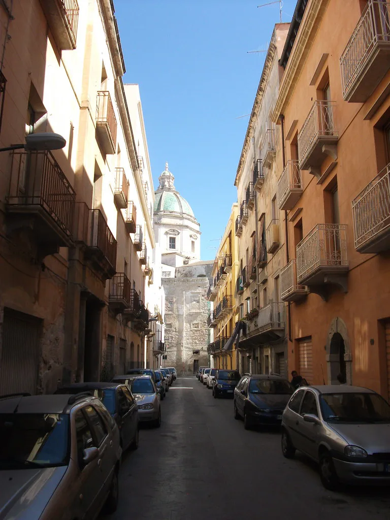 A narrow street in the old town of Trapani, Sicily, where the compact centre is best covered on foot or by short urban bus hops